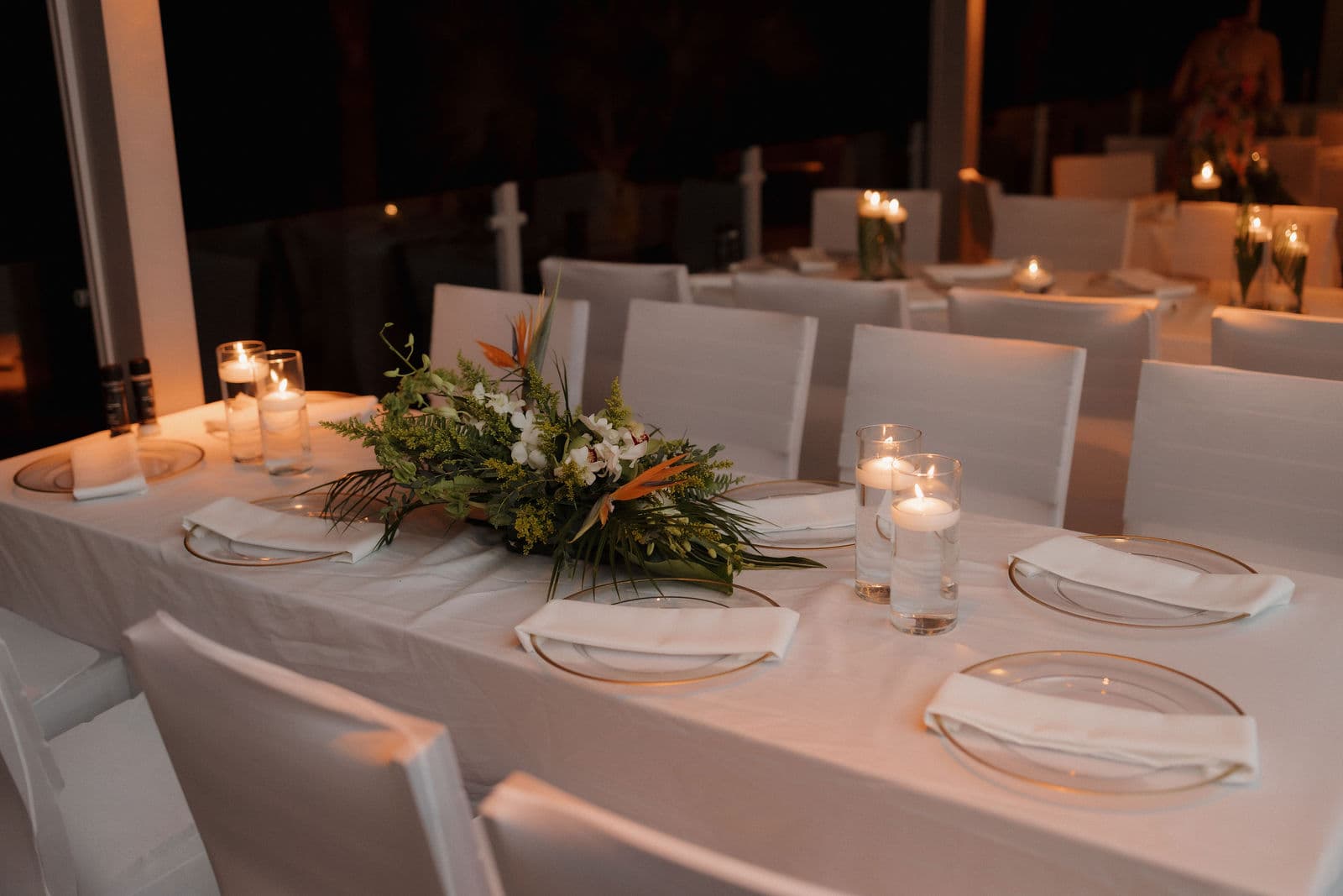 Elegant wedding table setting with tropical florals